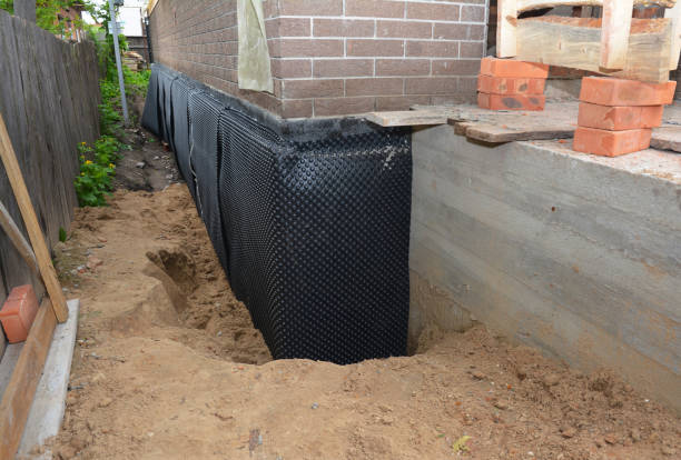 Happy homeowners after waterproofing job in Catonsville